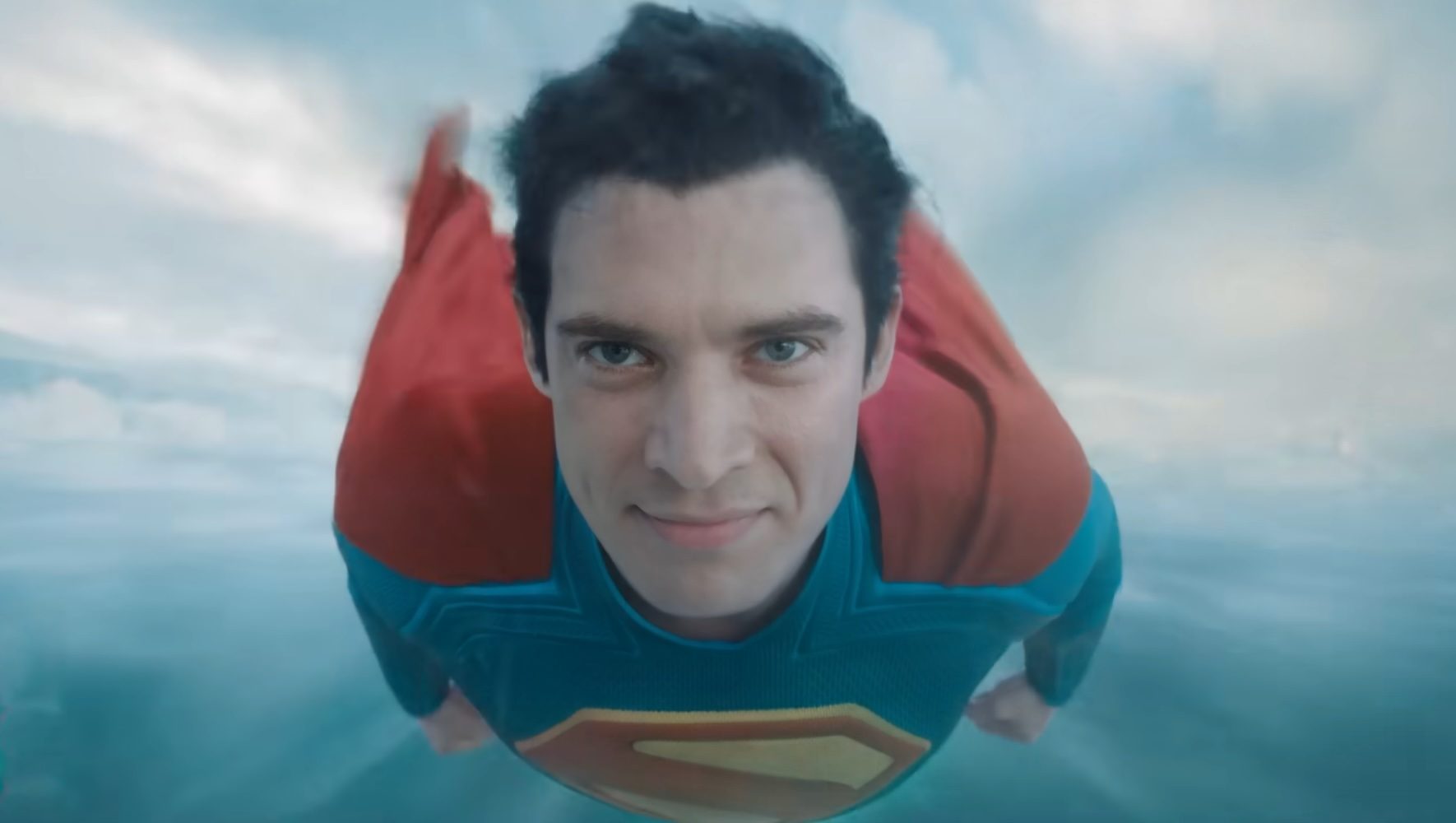 David Corenswet as Superman flying toward the camera in Superman.