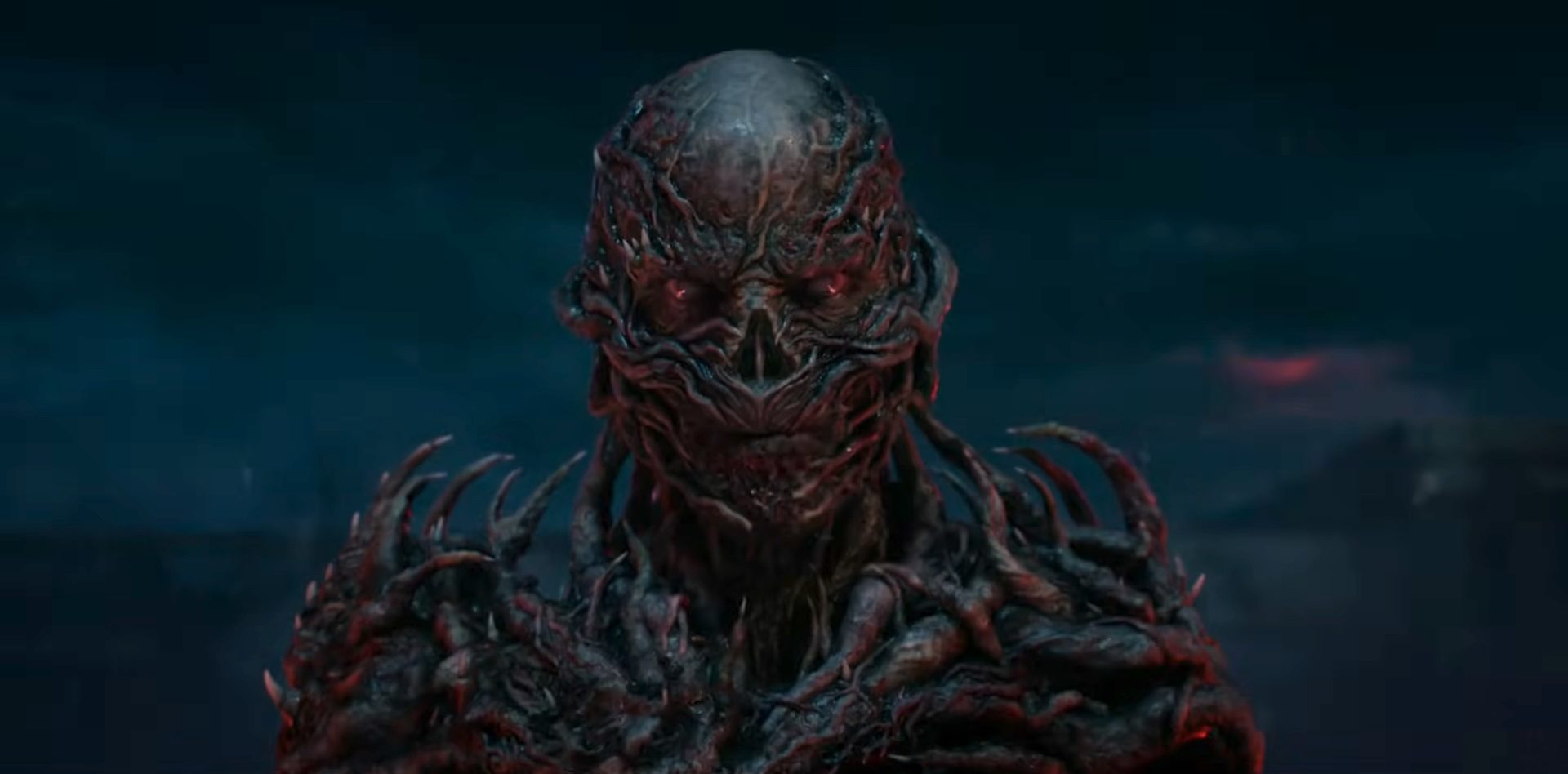 Jamie Campbell Bower as Vecna appearing from the Upside Down in Stranger Things season 5.