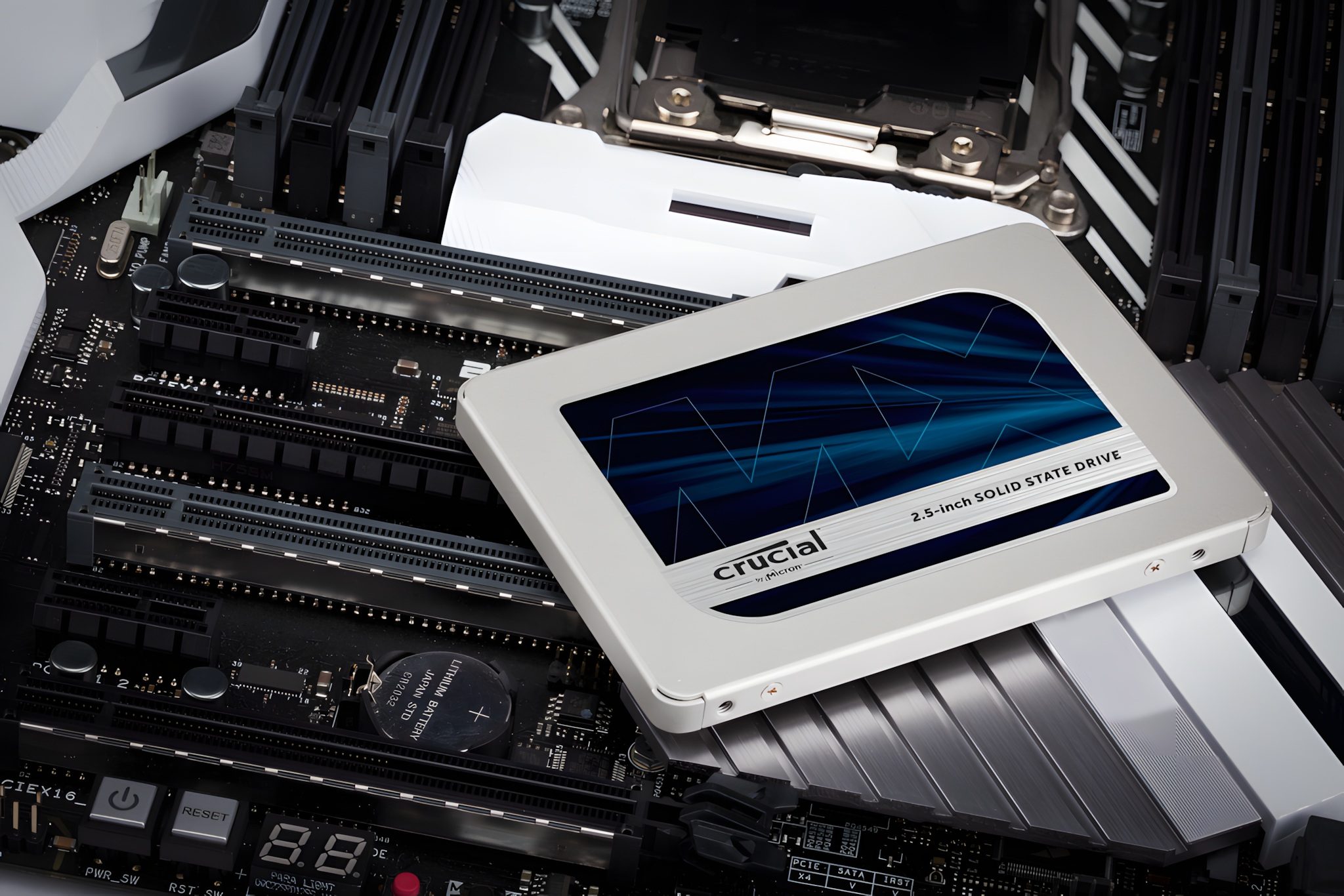The Crucial MX500 SSD sitting on a motherboard.