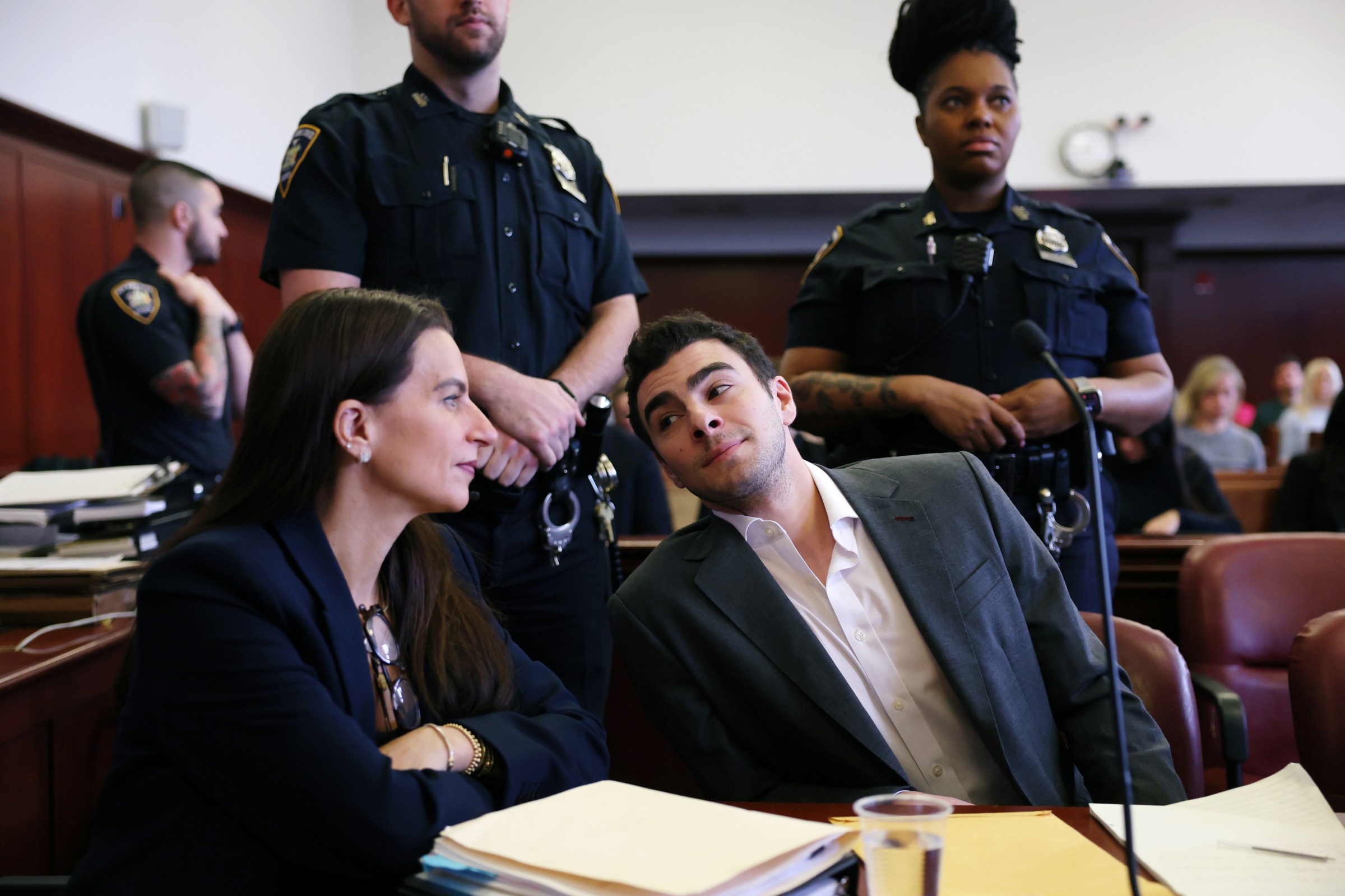 Mangione in Manhattan Supreme Court alongside his attorneys on Thursday.