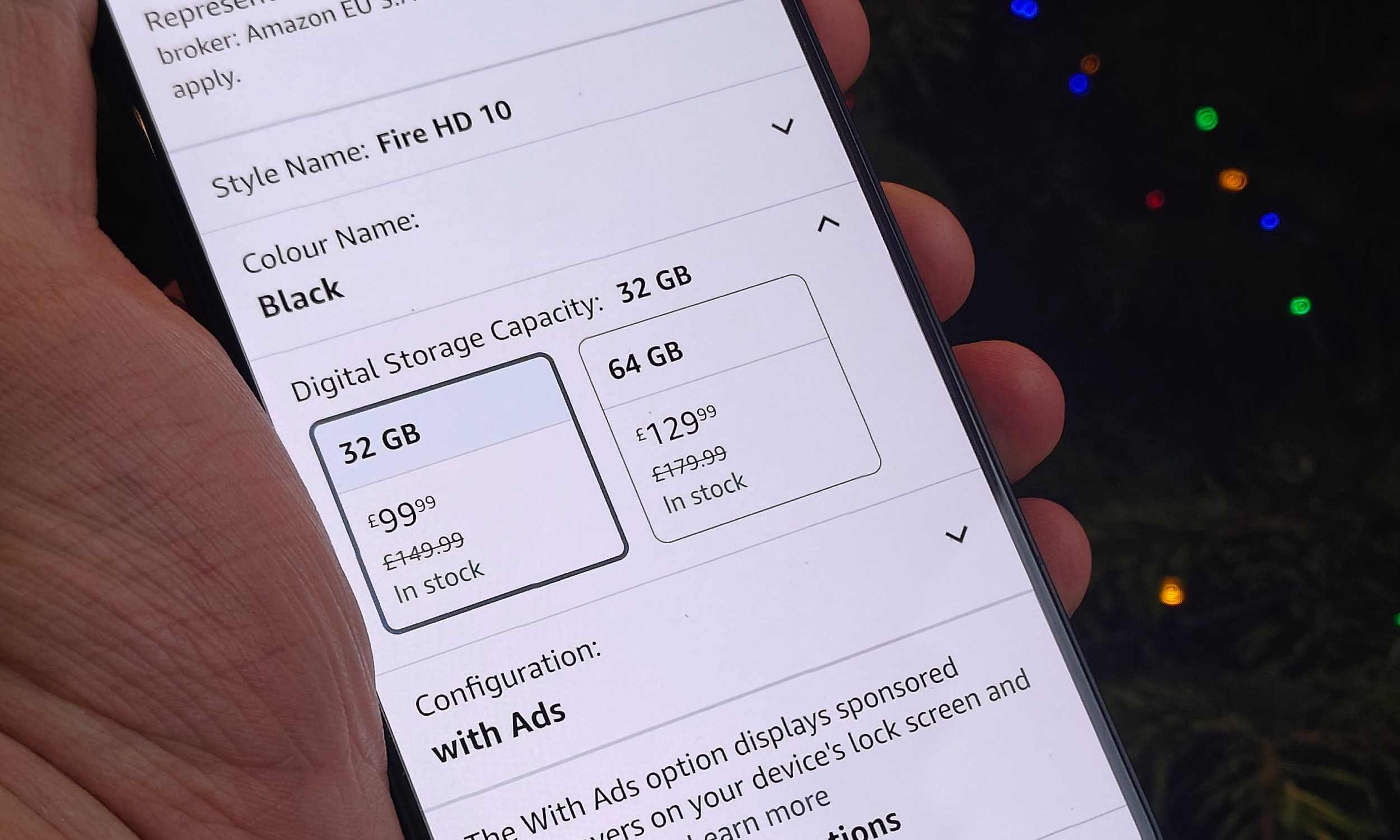 An Android phone showing two variants of the Fire Tab 10 on the Amazon app.