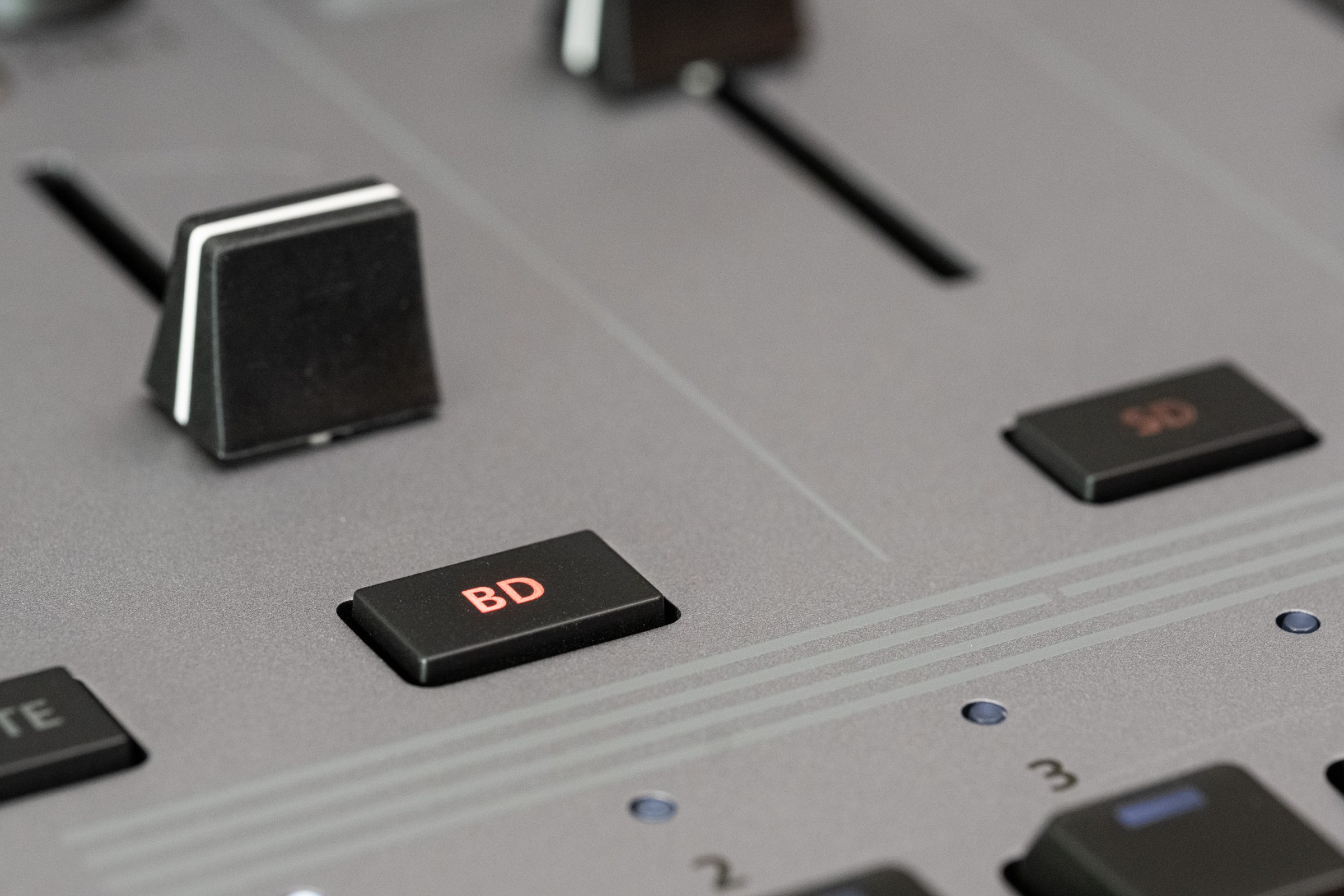 The bass drum button on the TR-1000.