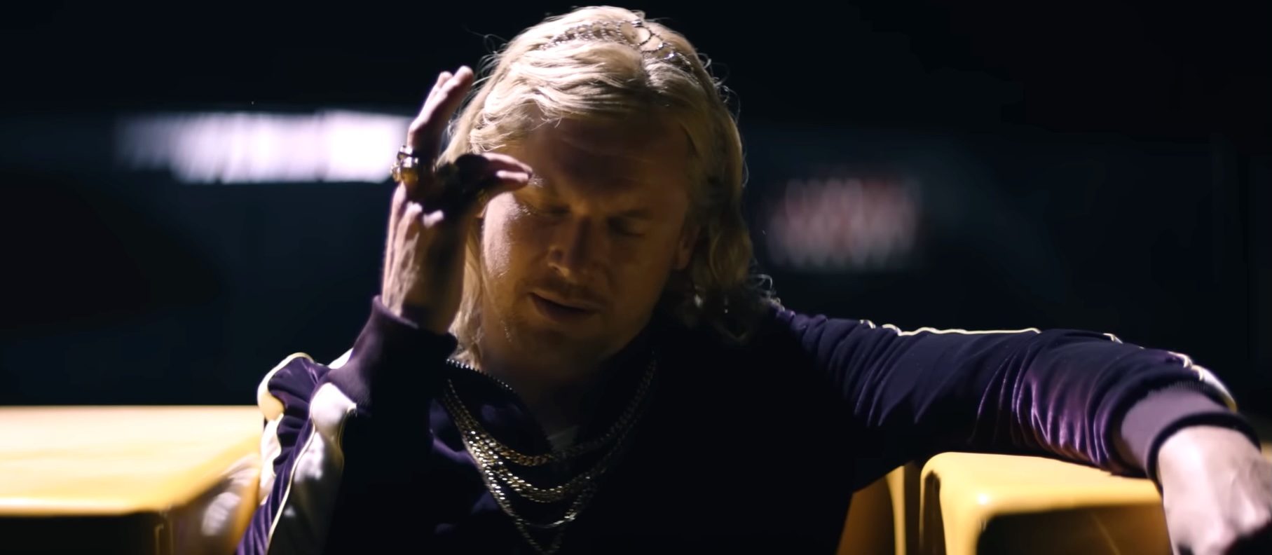 Jimmy Crystal (Jack O'Connell) with his hand to his temple in 28 Years Later The Bone Temple