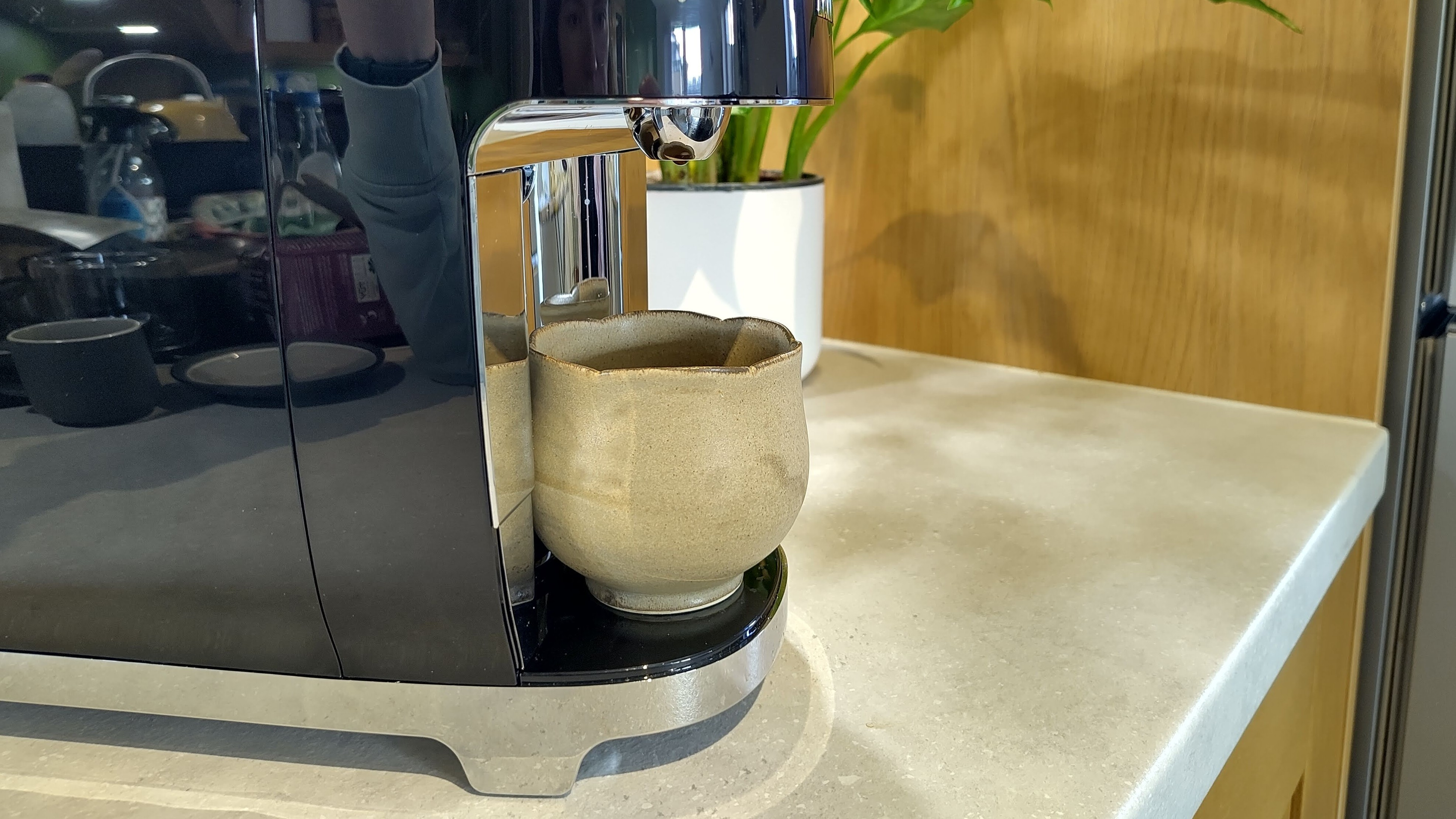 Cup placed on Lavazza A Modo Mio Smeg coffee maker drip tray