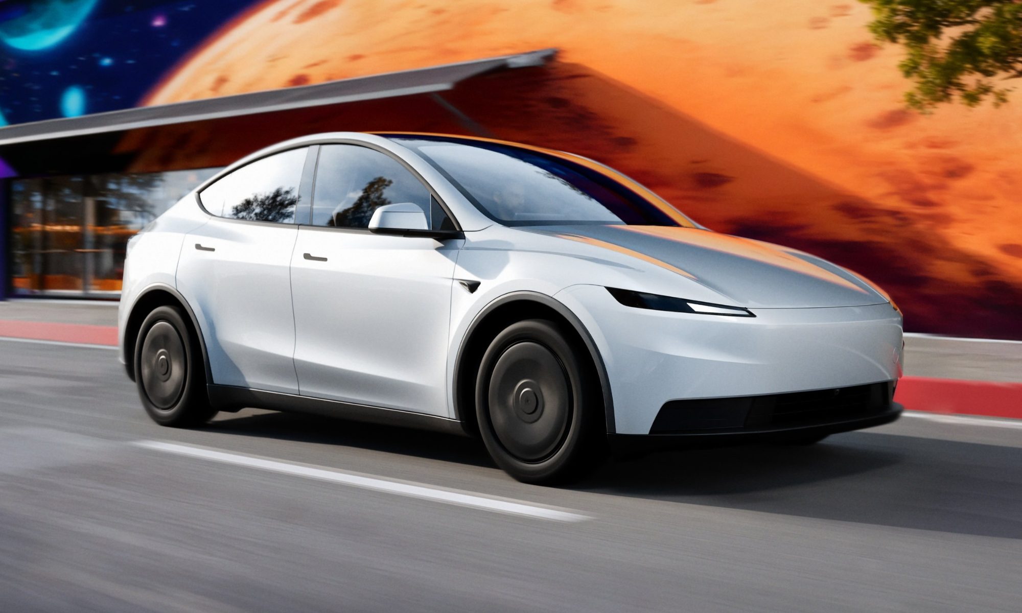 Image of a Tesla EV shown moving on the road.