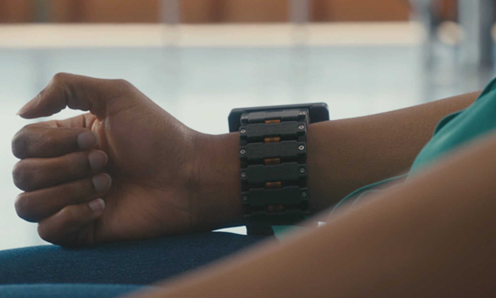 Person wearing Meta EMG braclet.