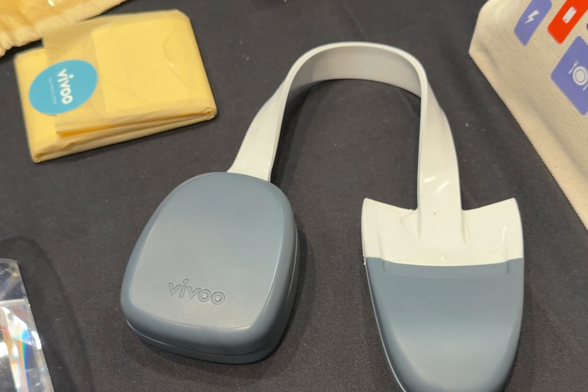 Here’s Vivoo’s $99 hydration tracker that goes in your toilet, and its smart menstrual pad in the upper left.