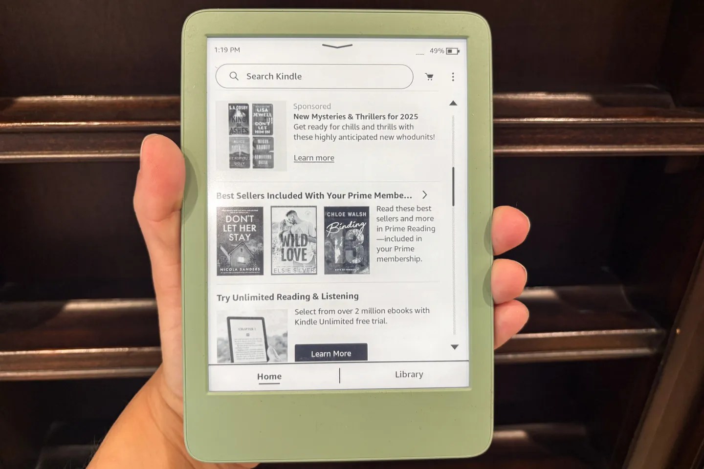 The 11th-generation Kindle being held.