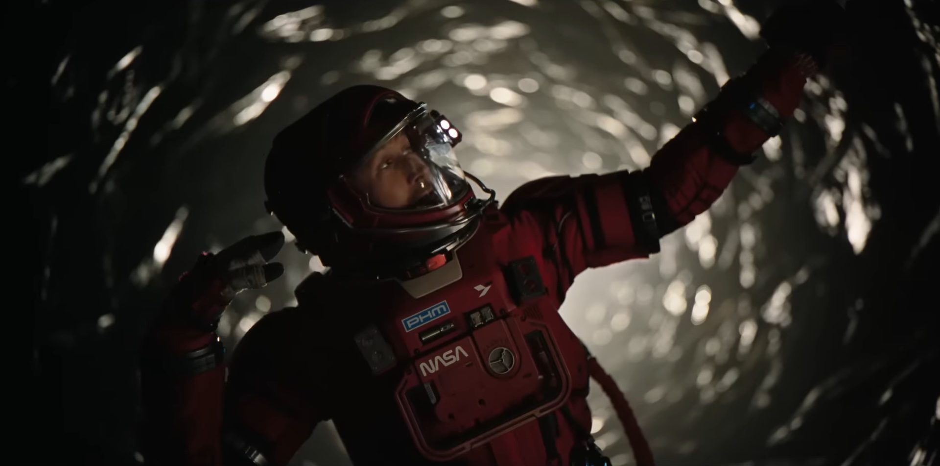 Dr. Ryland Grace (Ryan Gosling) striking a pose in the sci-fi film, Project Hail Mary.