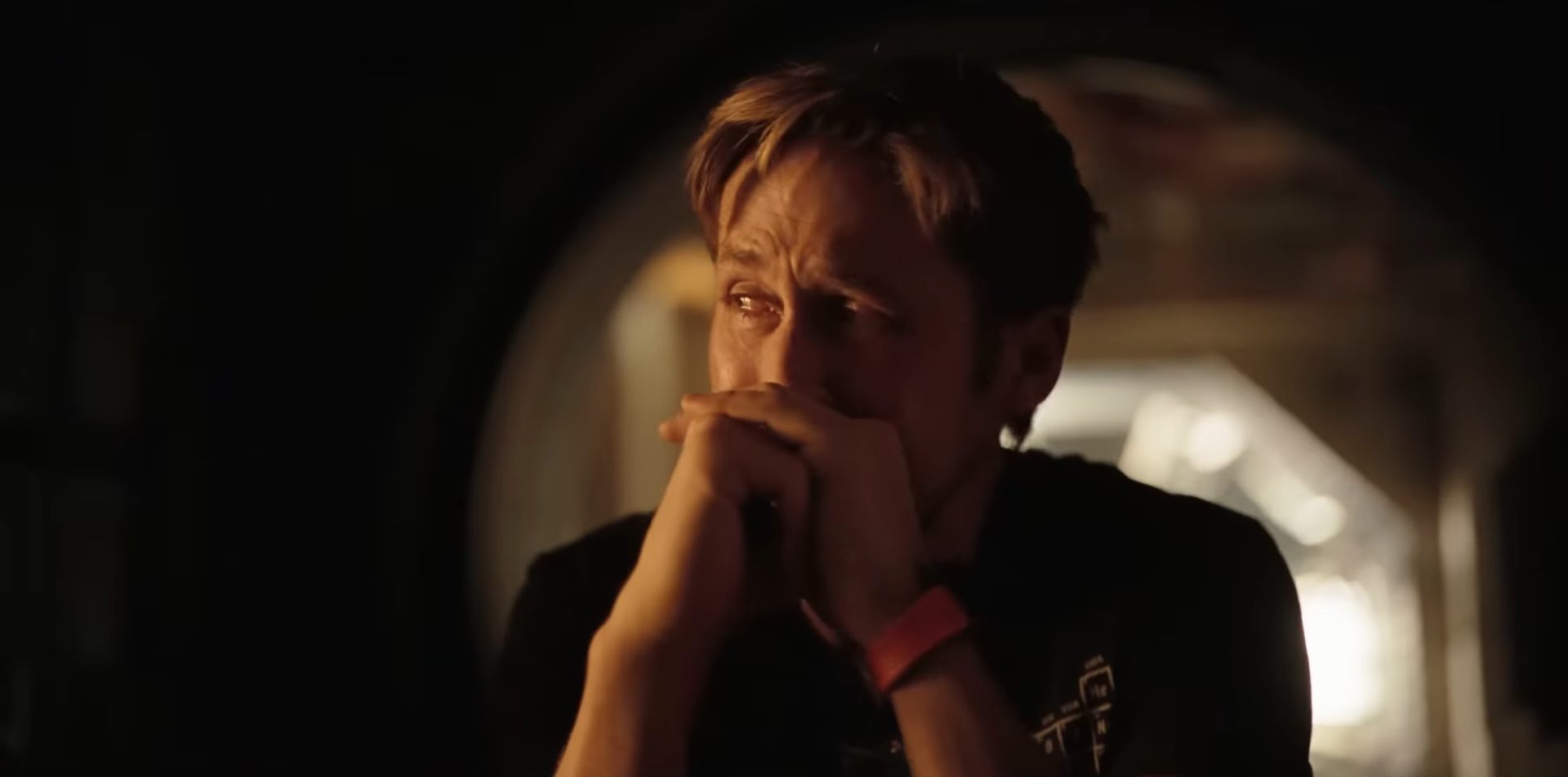 Ryan Gosling crying in a spaceship as Dr. Ryland Grace in the sci-fi film, Project Hail Mary.