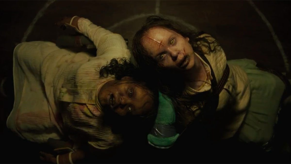 Angela Fielding (Lidya Jewett) and Katherine West (Olivia O'Neill) look up while possessed in The Exorcist: Believer.