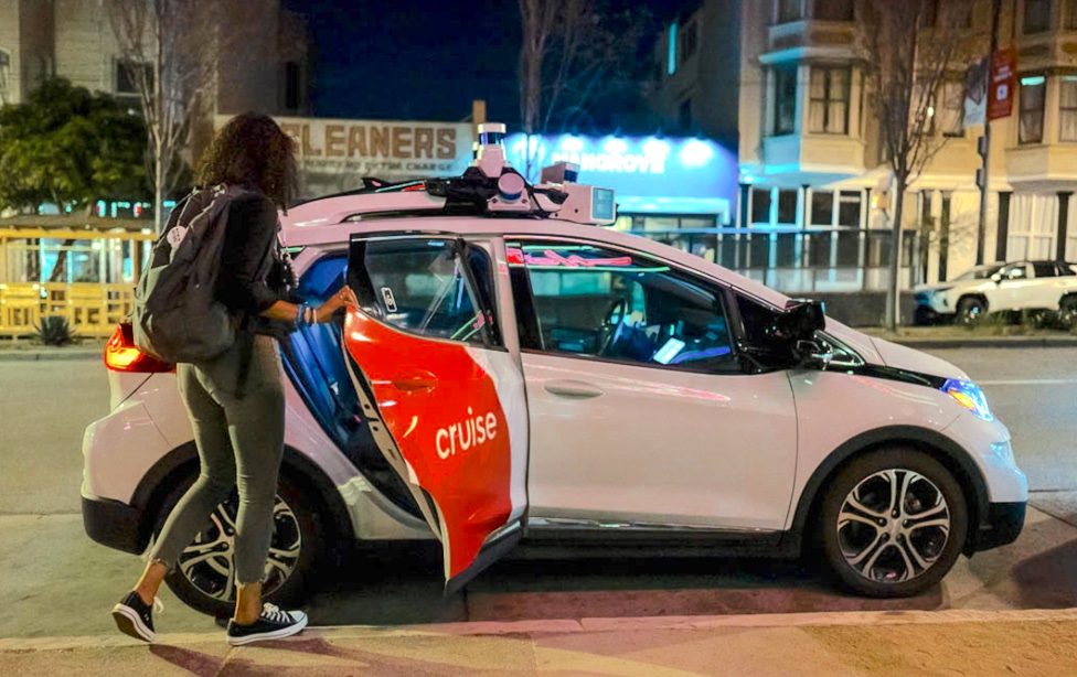 A passenger getting into a Cruise robotaxi.