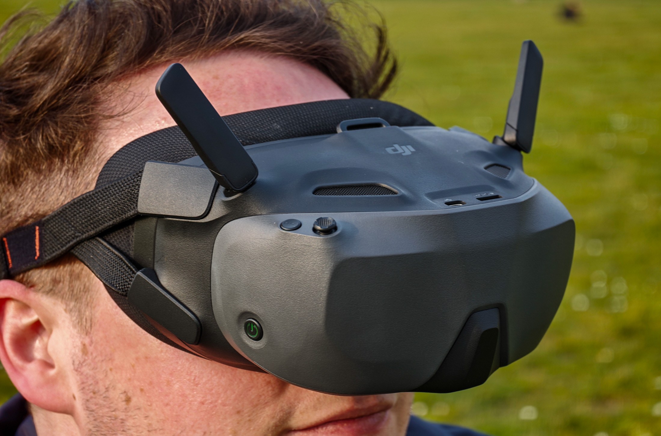 Photo of the DJI Goggles N3 on a man’s head