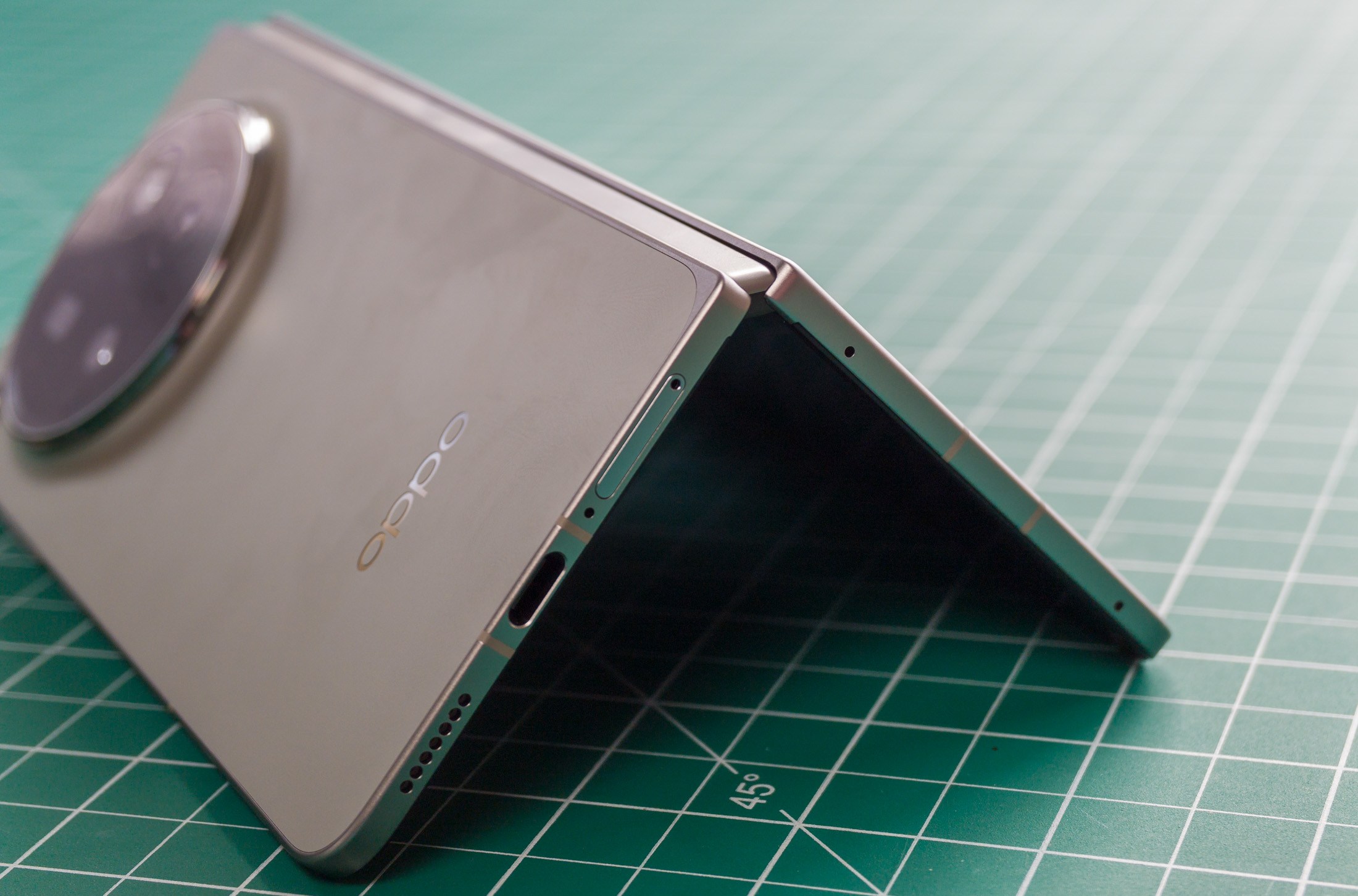 Photo of Oppo Find N6 on a green work mat in a tented position