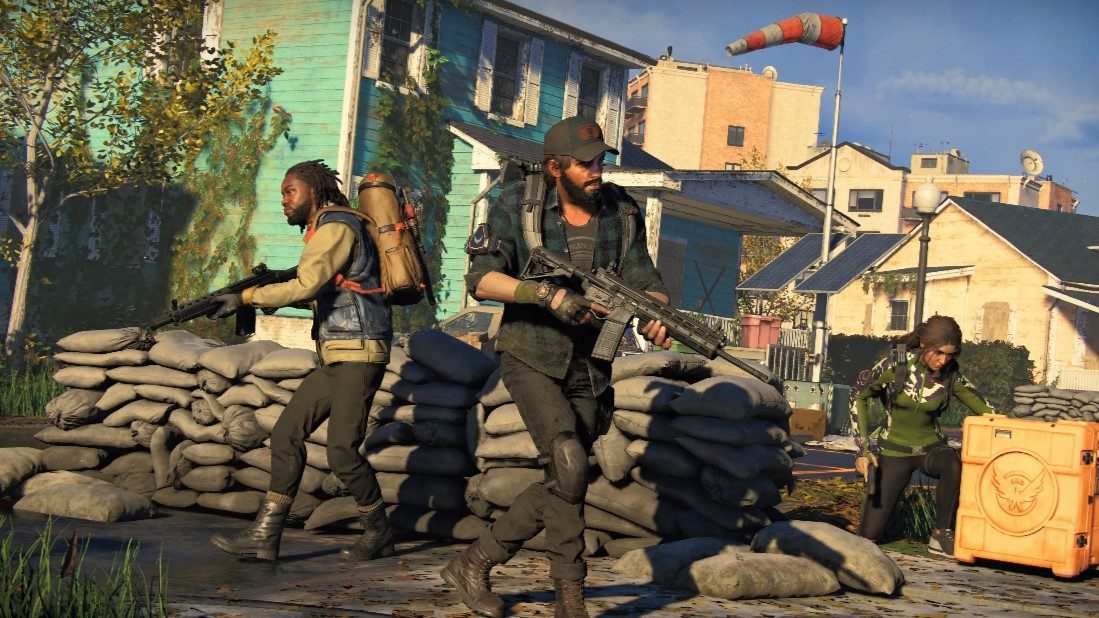 Characters holding guns in a messed up city in The Division Heartland