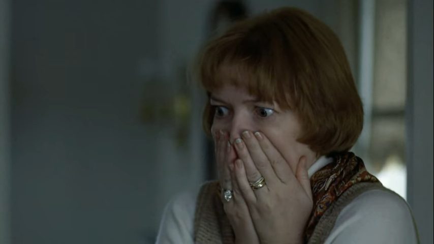 Chris MacNeil with her hands over her mouth, terrified, in The Exorcist (1973).