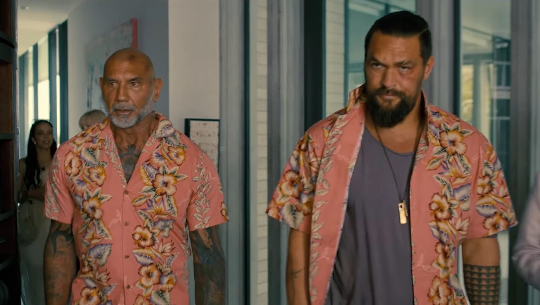 Dave Bautista and Jason Momoa wearing flowered shirts in The Wrecking Crew.