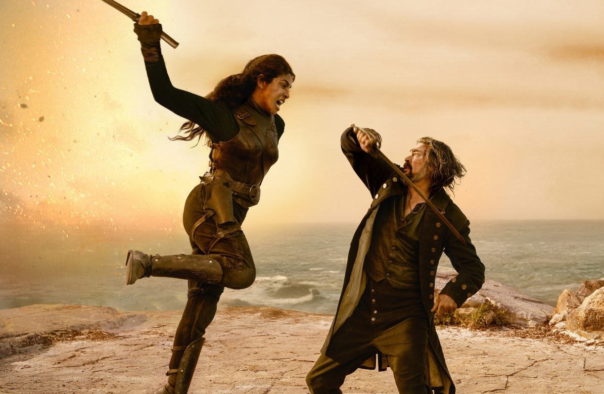 Priyanka Chopra and Karl Urban fighting with swords in a still from the film The Bluff.