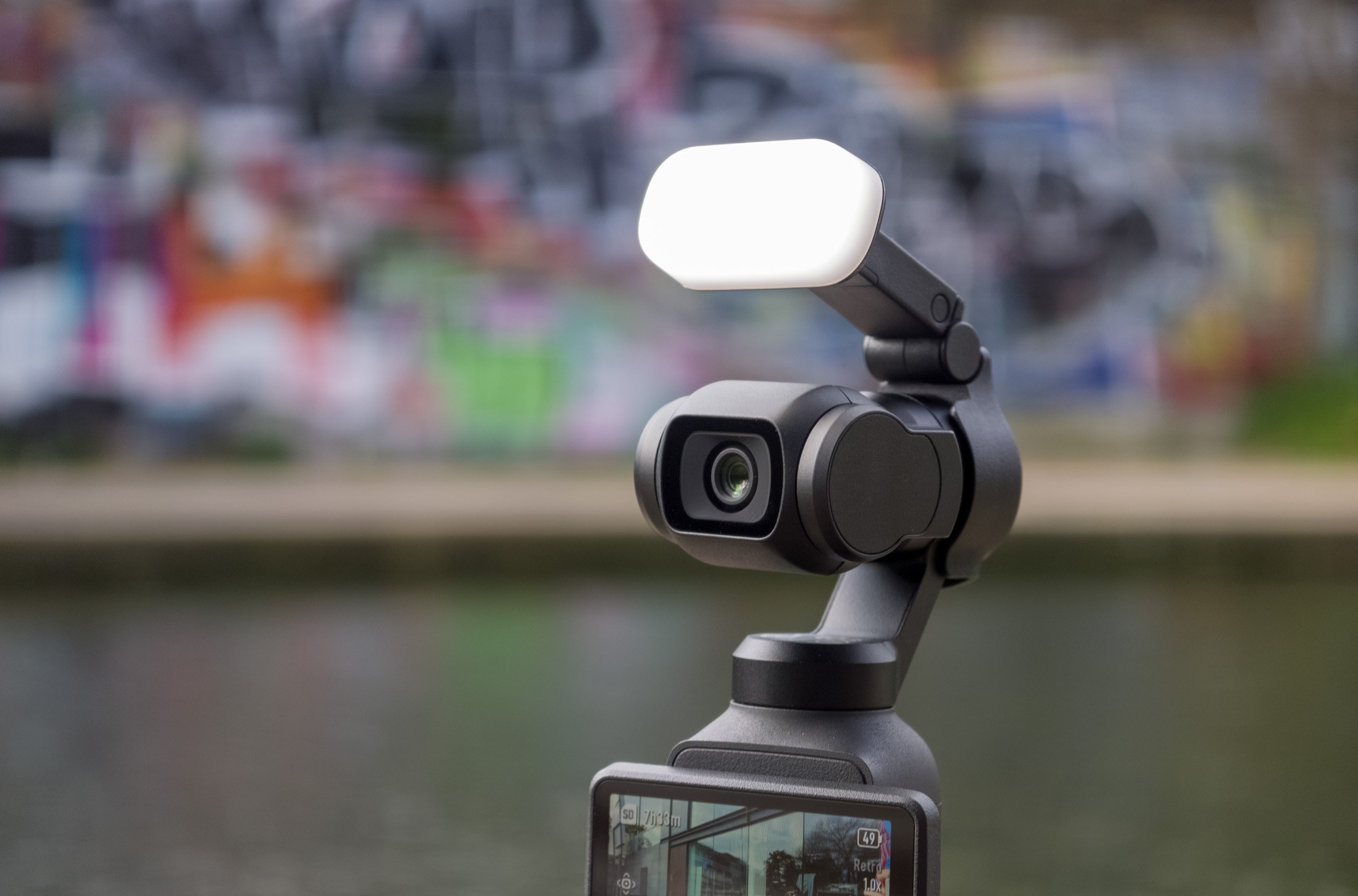 Photo of the DJI Osmo Pocket 4 camera and fill light