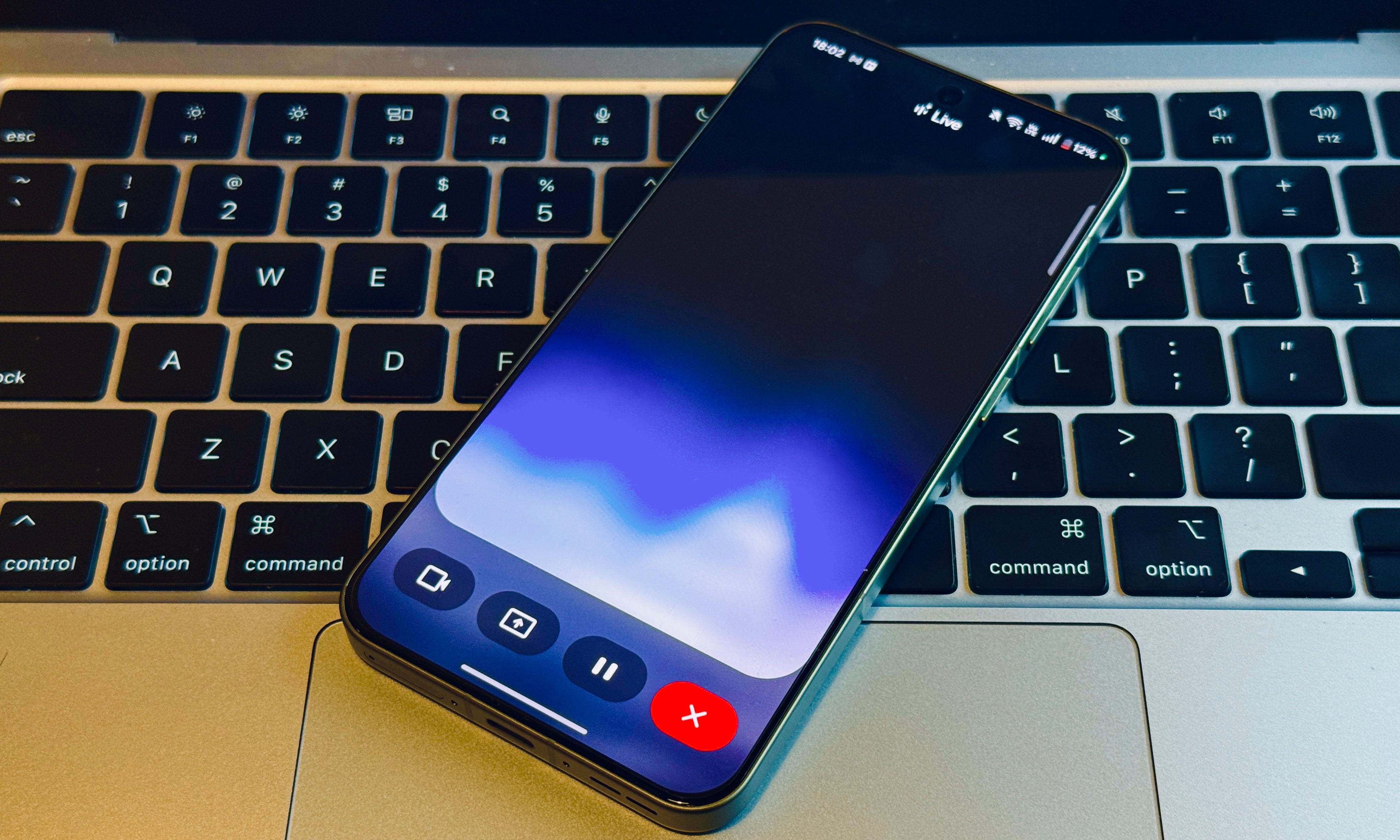 Gemini Live on a phone atop a keyboard.