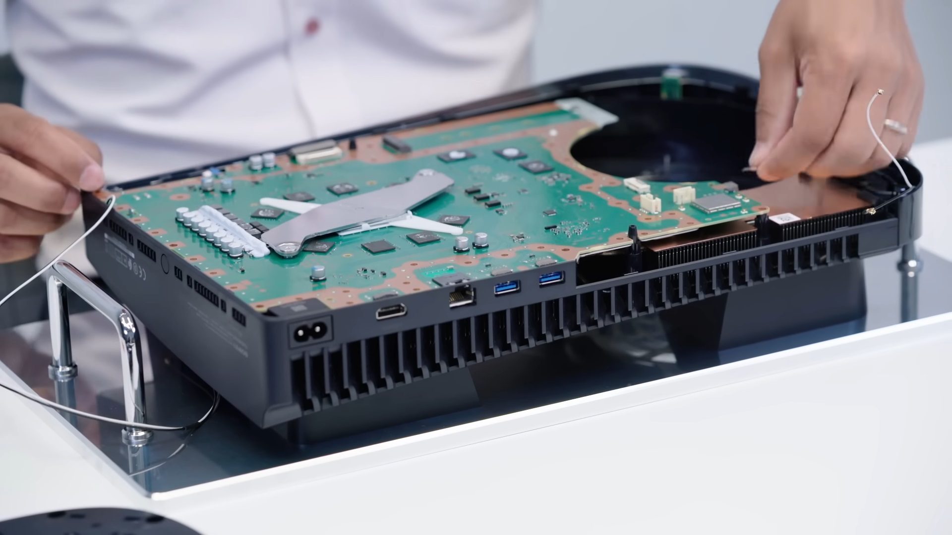 The PS5 disassembled on a table.