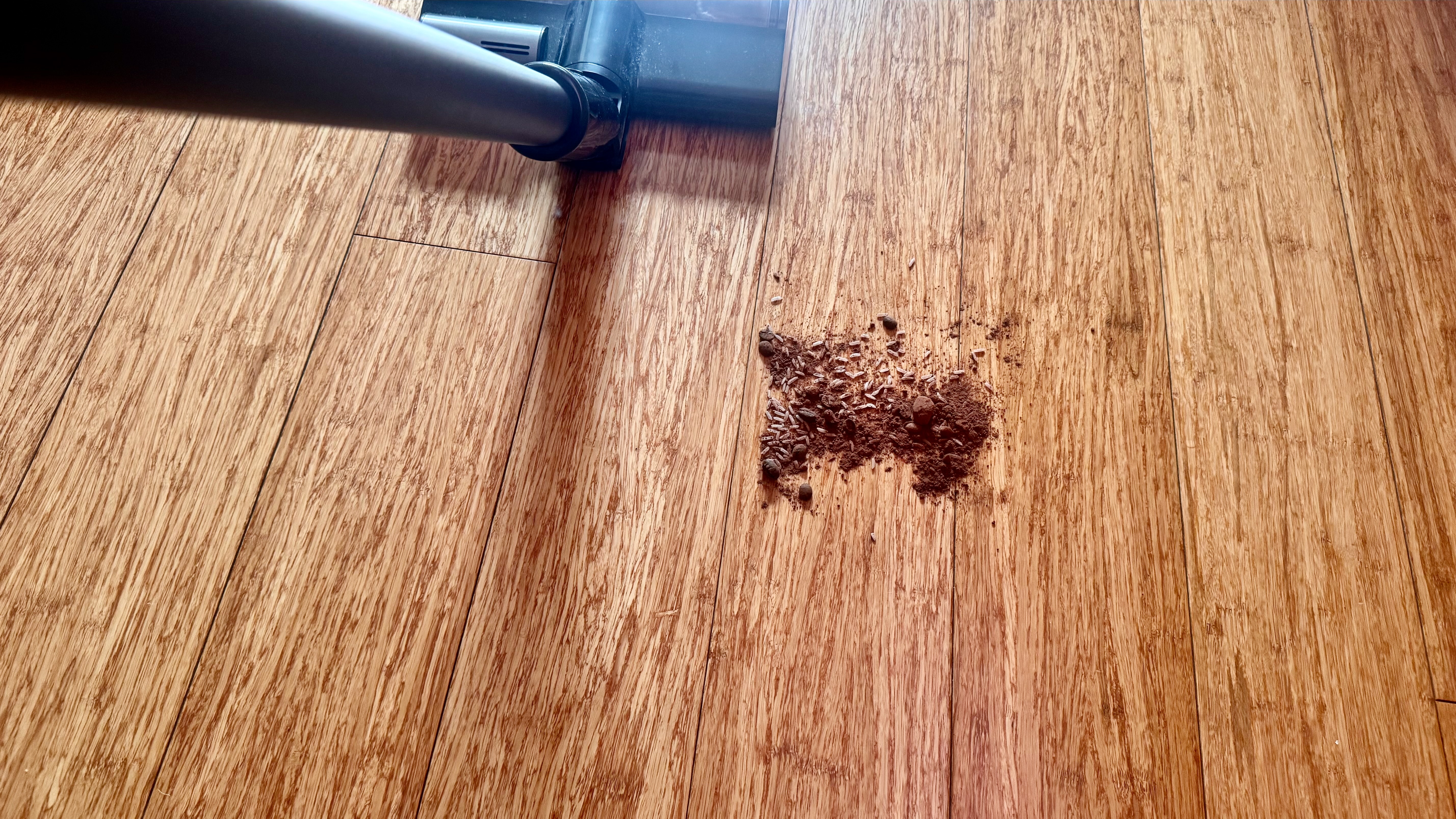 Debris spill being cleaned from a hard floor