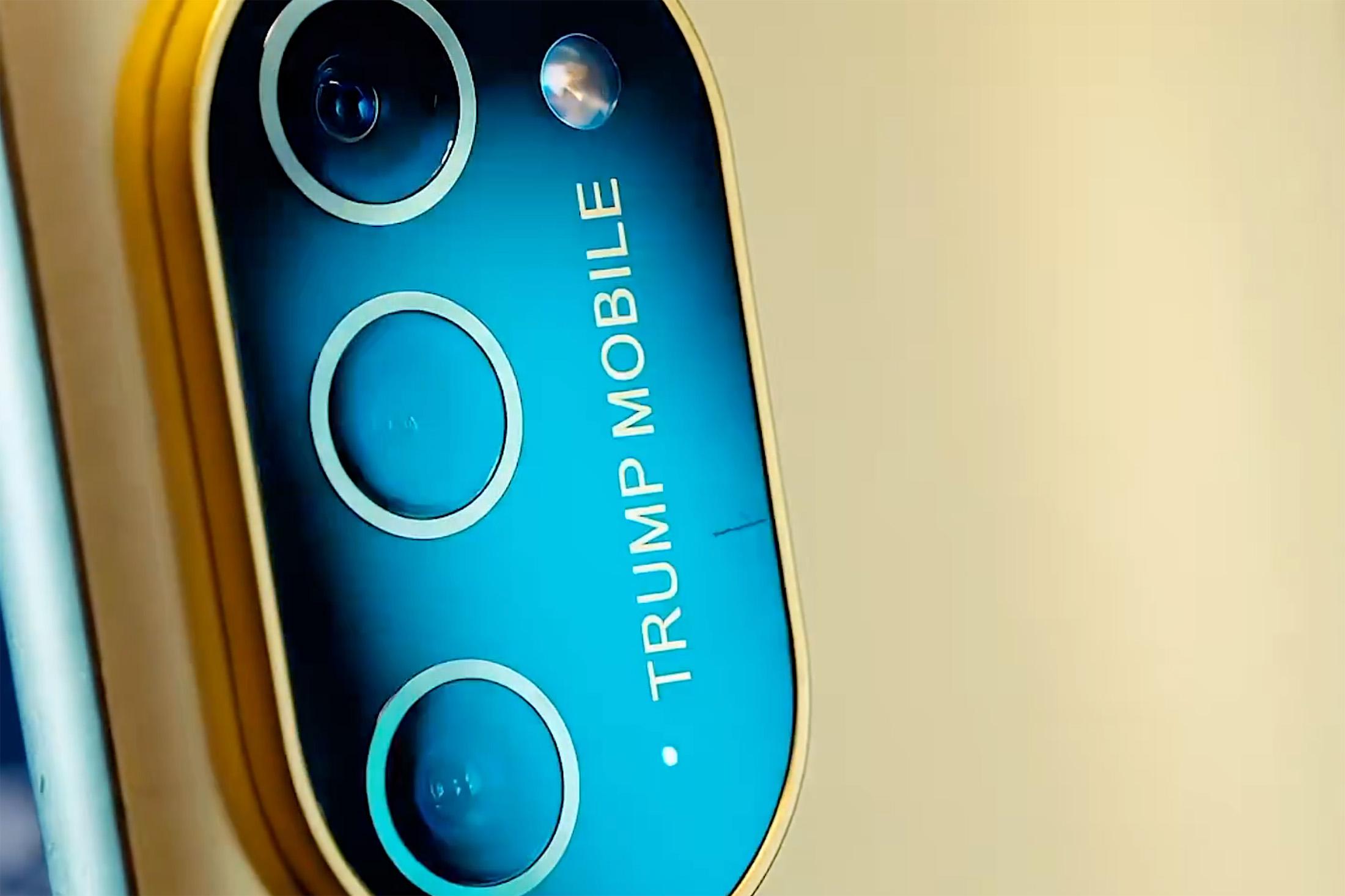 A still from Trump Mobile’s promotional video showing the T1 Phone with a scratch on the camera lens.
