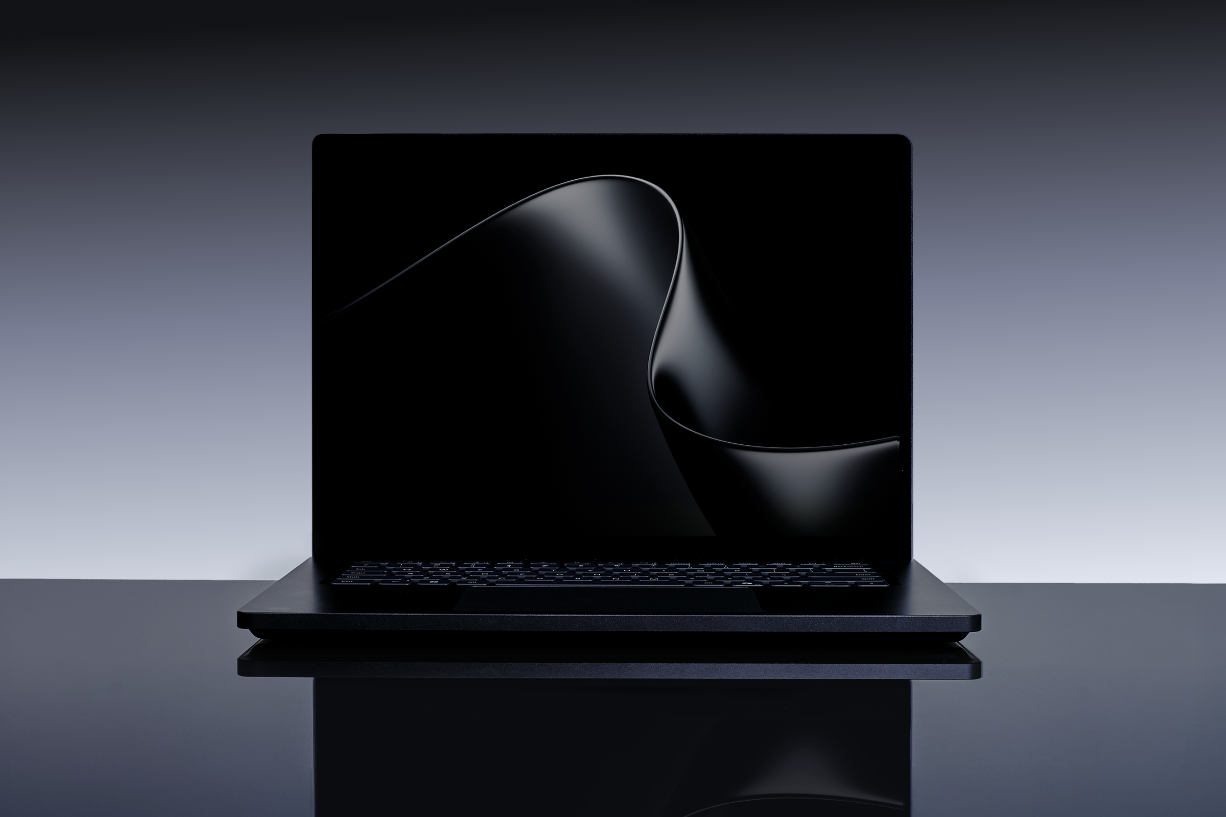 A shadowy image of a Microsoft Surface Laptop Ultra against a gradient gray background.