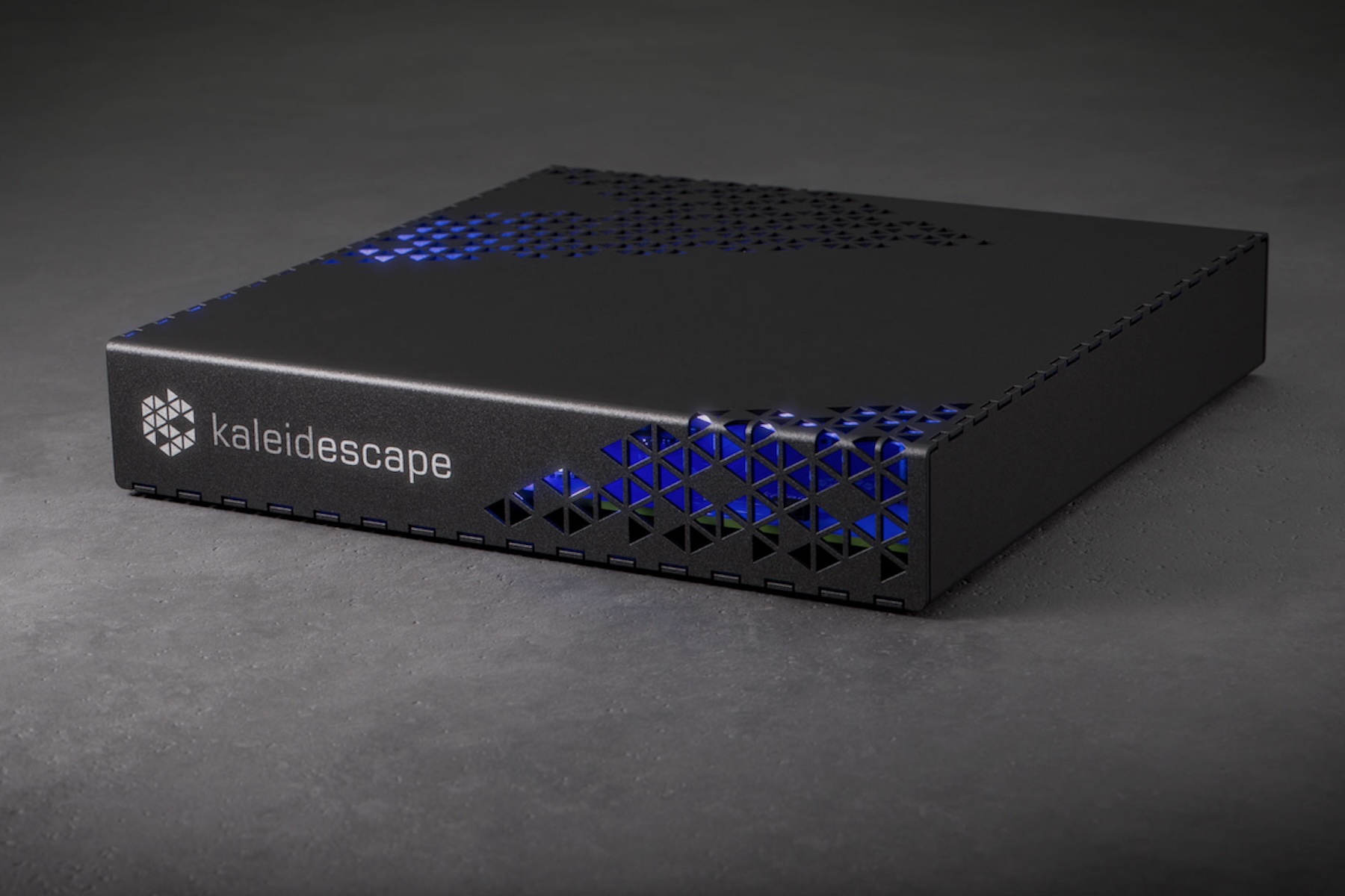 The Kaleidescape Strato E player on a gray surface.
