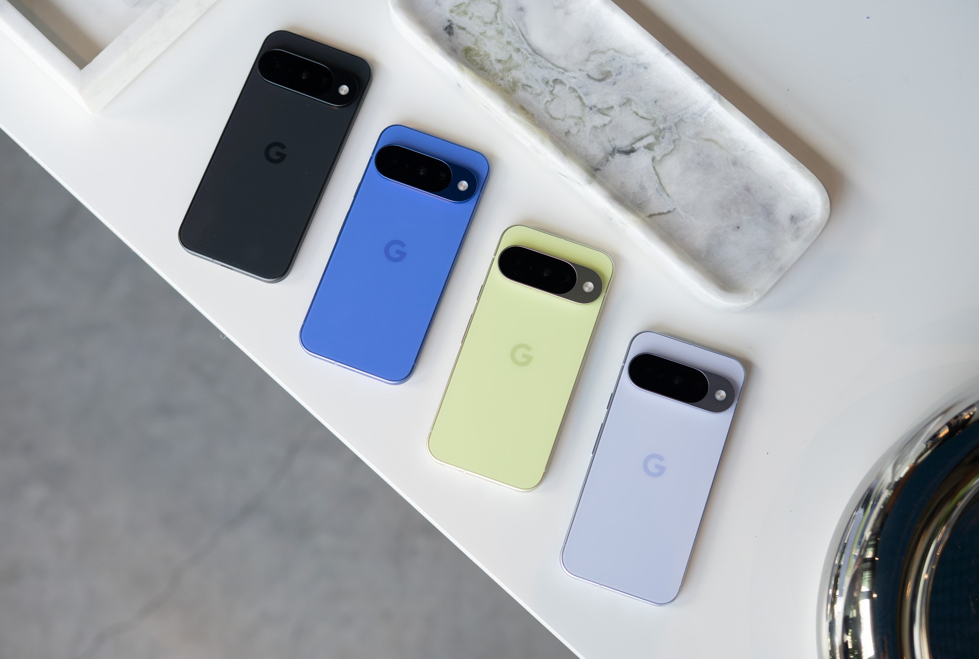 The Google Pixel 10 lineup on a table.