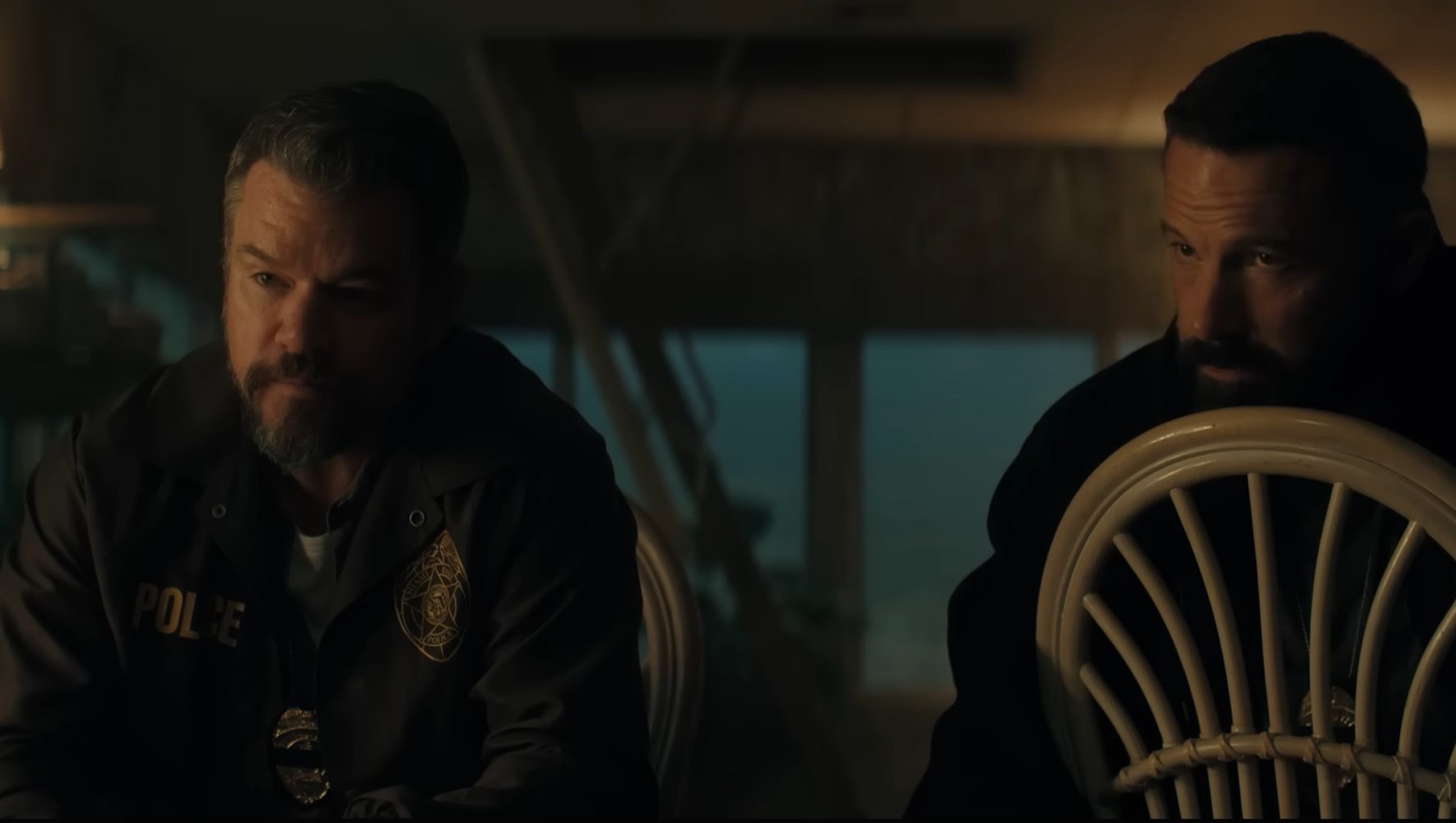 Matt Damon and Ben Affleck sitting down in The Rip.