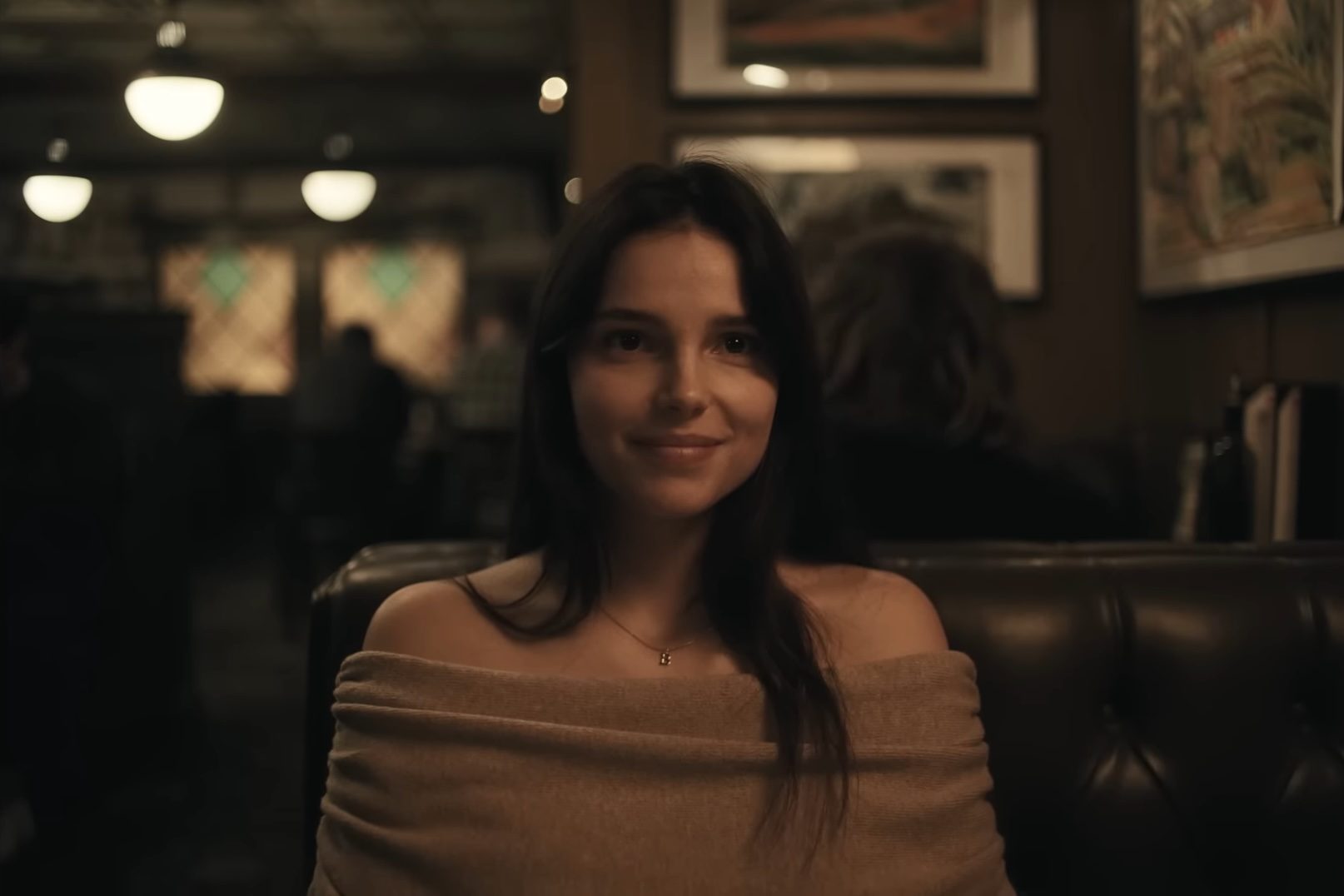 Nikki Freeman (Inde Navarrette) smiling in a diner in the horror film, Obsession.