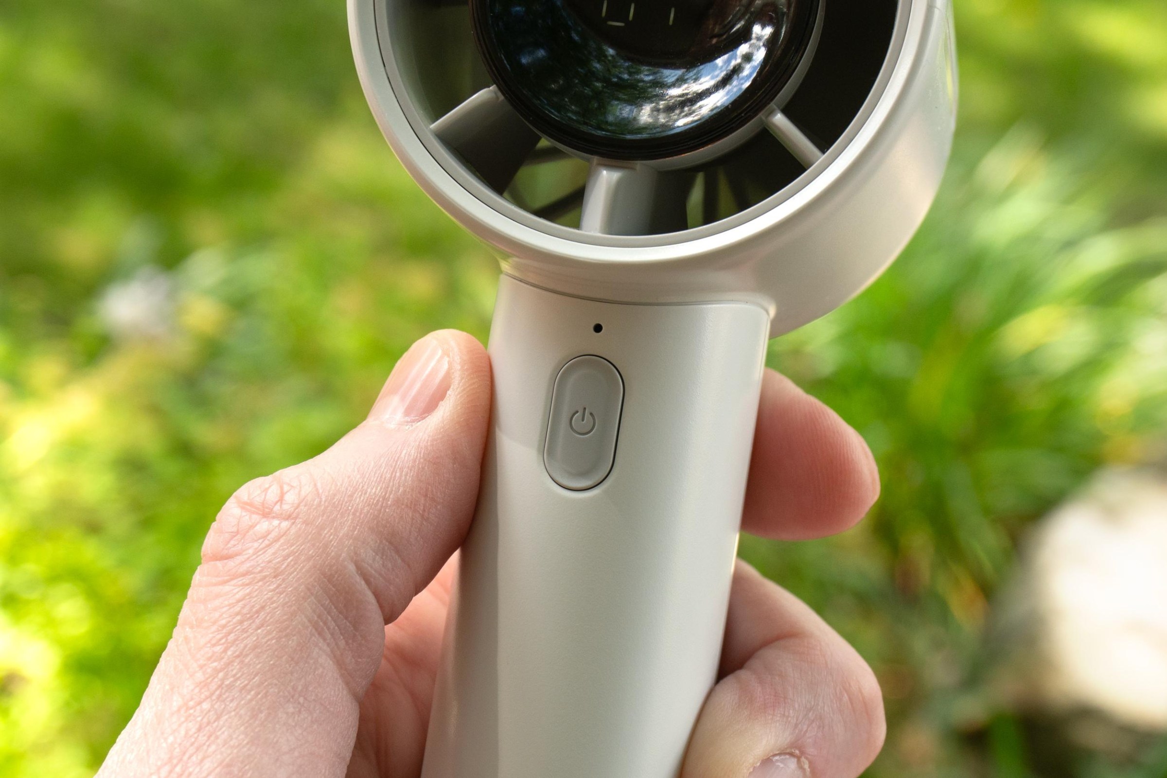 A close-up of JisuLife Life10 S fan’s power button on the front.