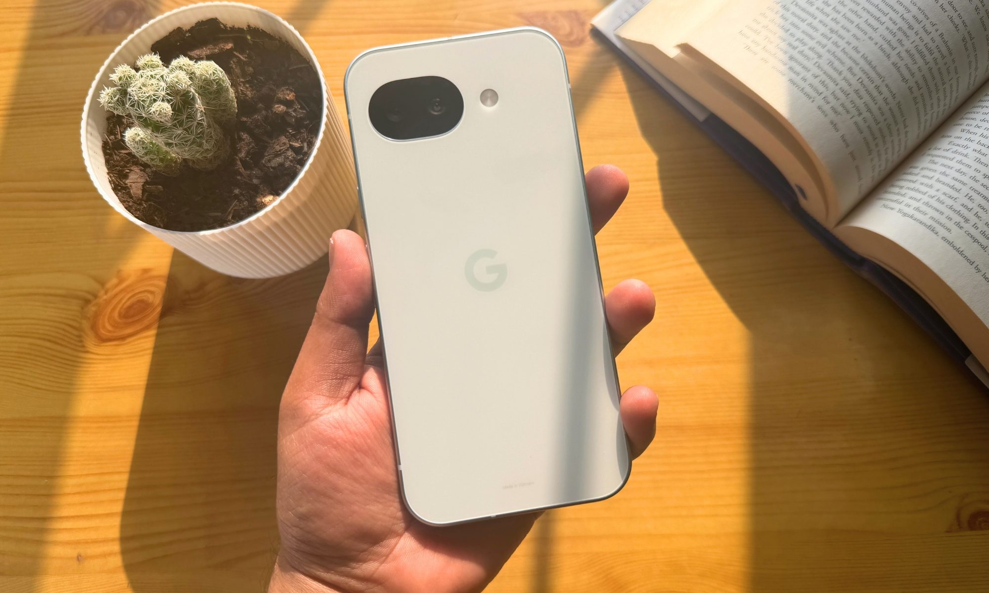 Google Pixel 10a in the hands of a person.