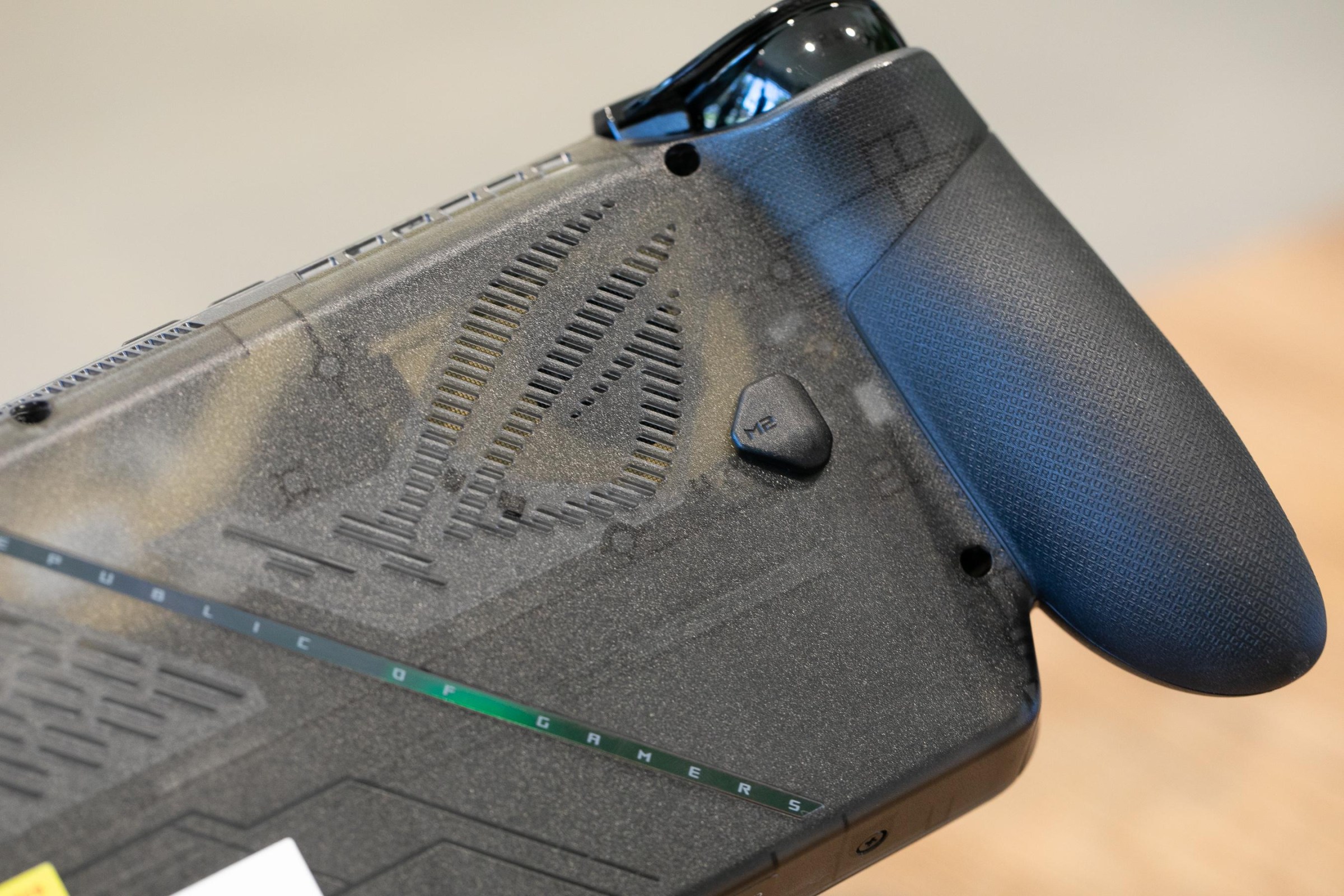 The back of the Ally shows its frosted translucent frame and distinct rubberized grip.