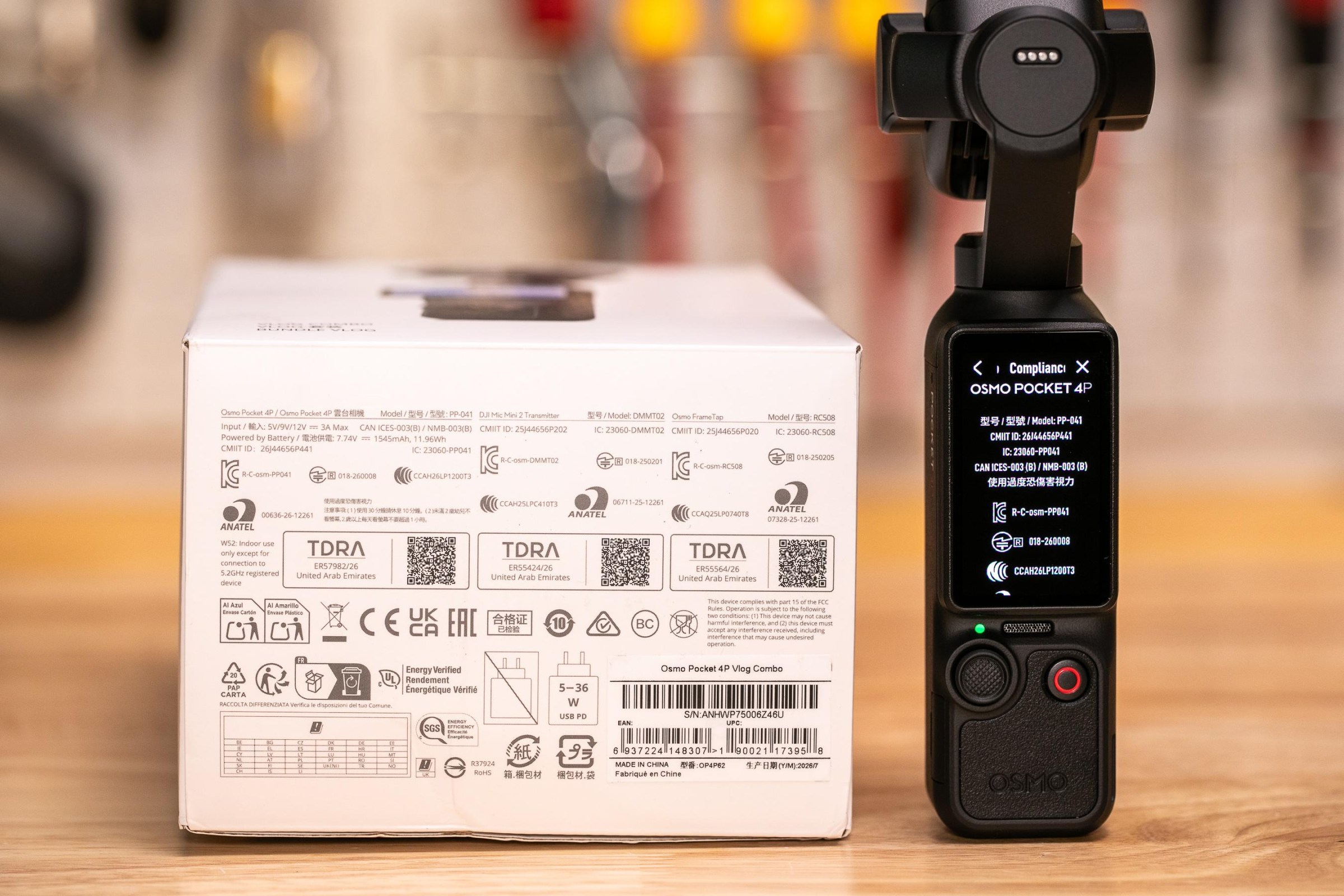 The packaging is primarily in English, Chinese, and French, but has regulatory markings from many countries including Canada, China, Brazil, Japan, Korea, and the UAE.