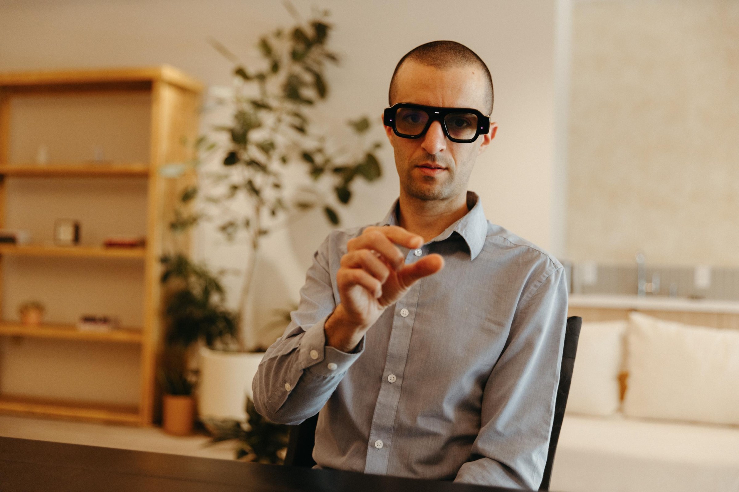 A photo of The Verge’s Jay Peters wearing Snap’s Specs AR glasses.