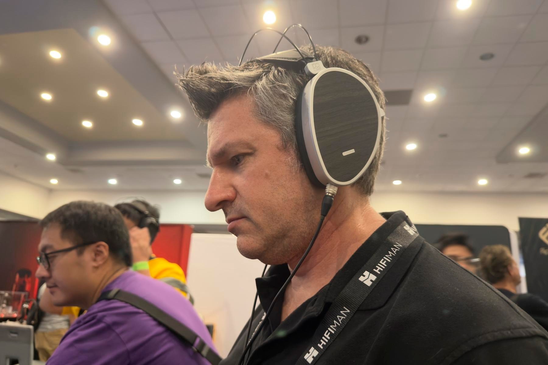 A man wearing the Dan Clark Audio Aeon Core at CanJam SoCal 2026.